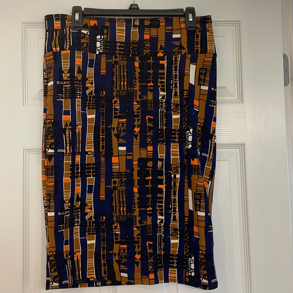 Luluroe skirt, navy blue with black, orange, brown and cream designs